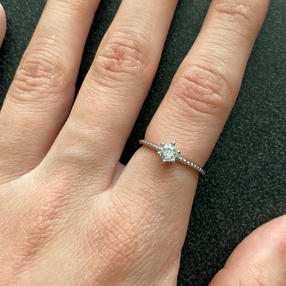 Silver ring with cubic zirconia in the center